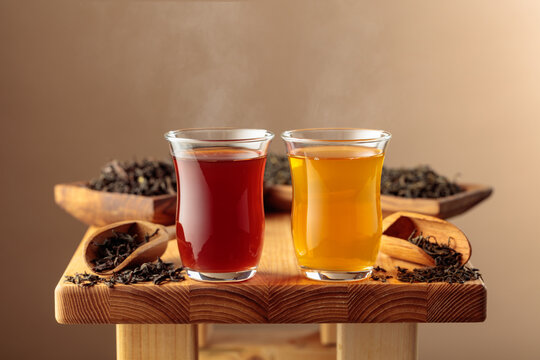 Black and green tea in small glass cups.