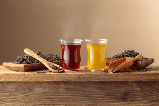 Black and green tea on an old wooden table.