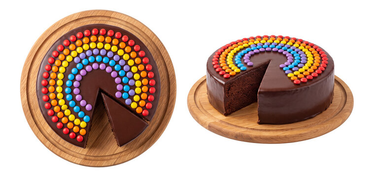 chocolate birthday cake coated in glaze and decorated with rainbow candy beans