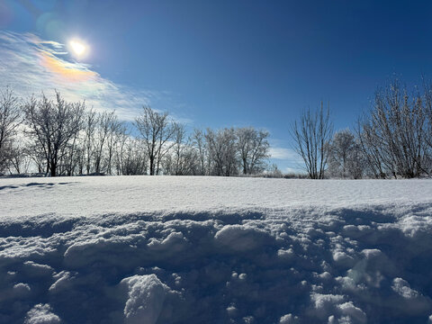 Winter nature with deep white snow and blue sky 