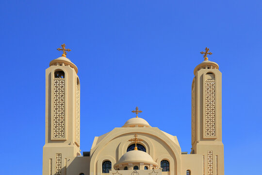 Coptic Orthodox Heavenly Cathedral towers with golden crosses Egypt Sharm El Sheikh