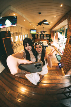 Portrait of Gen Z asian young woman wide angle aesthetic Y2K bohemian fashion travel in Bangkok