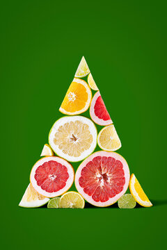 Citrus fruit slices arranged in triangular Christmas tree shape
