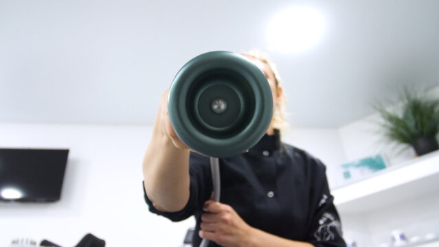 Professional body shaping therapy with vibromassage thermo vacuum and bioelectrical stimulation in beauty salon. 