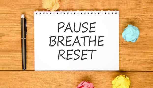 Pause breathe reset words symbol. Concept words Pause breathe reset on beautiful white note. Beautiful wooden background. Business support motivational and pause breathe reset concept. Copy space.