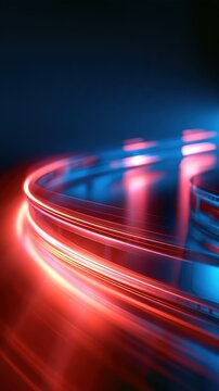dynamic abstract background with glowing red and blue light trails curving smoothly over a dark reflective metallic surface creating a sense of high speed motion and futuristic energy